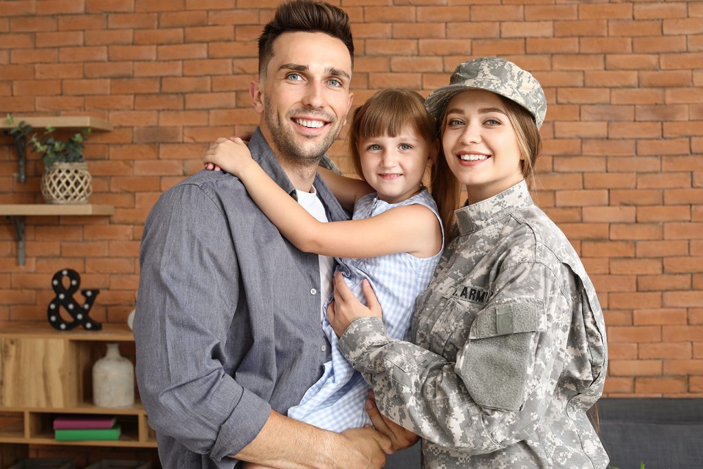 Happy female soldier with her family at home just before a notary family member helps her with her documents and discusses how to proceed to notarize for Family Members she  ships off overseas
.
