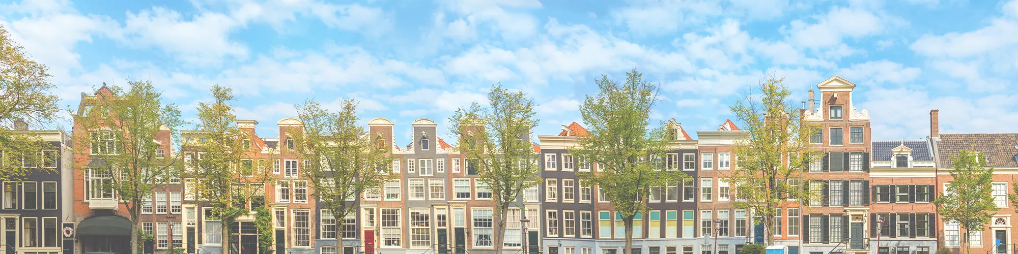 background image of row houses and blue sky